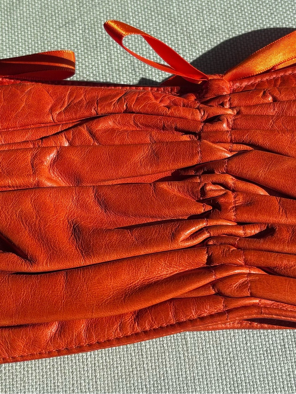 Cammiehill Orange Leather Ruched Clutch
